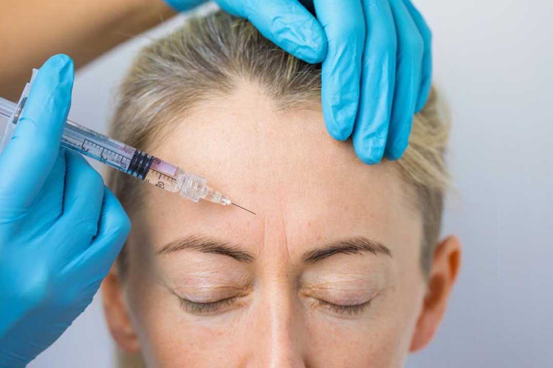 A lady undergoing a facial injection treatment.