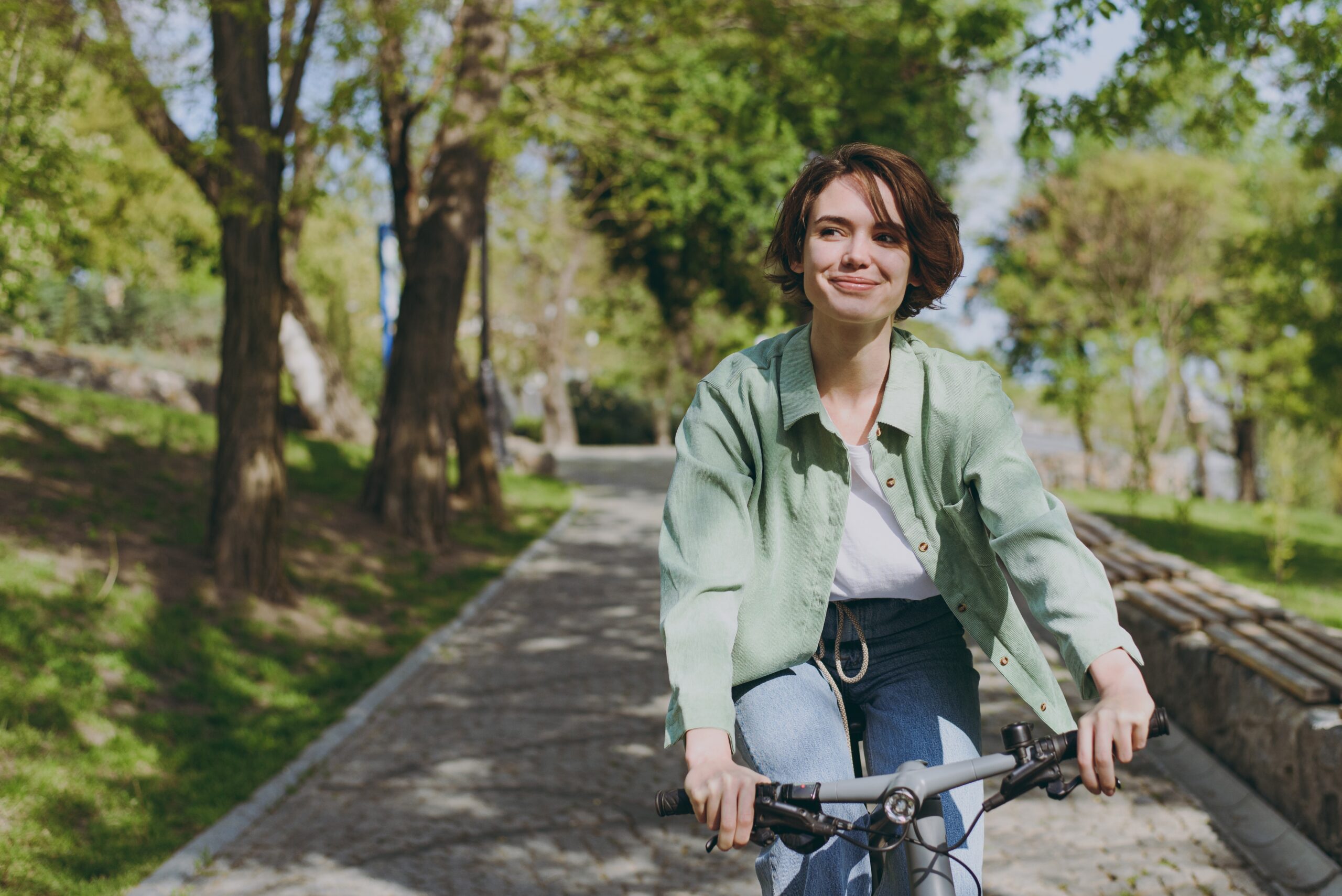 Young Pensive Dreamful Happy Woman 20s Wearing Casual Green Jacket